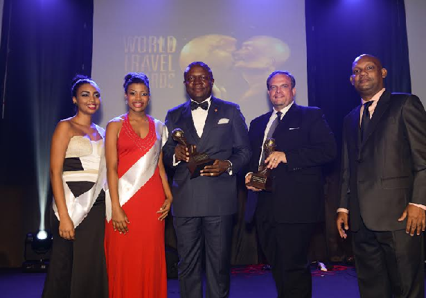 transcorp award 3 - THEWILL NEWS MEDIA Transcorp Hotels Plc CEO Valentine Ozigbo and Transcorp Hilton Abuja GM Etienne Gaillez, surrounded by well-wishers after receiving an impressive five awards, during the 2015 World Travel Awards, in Seychelles.