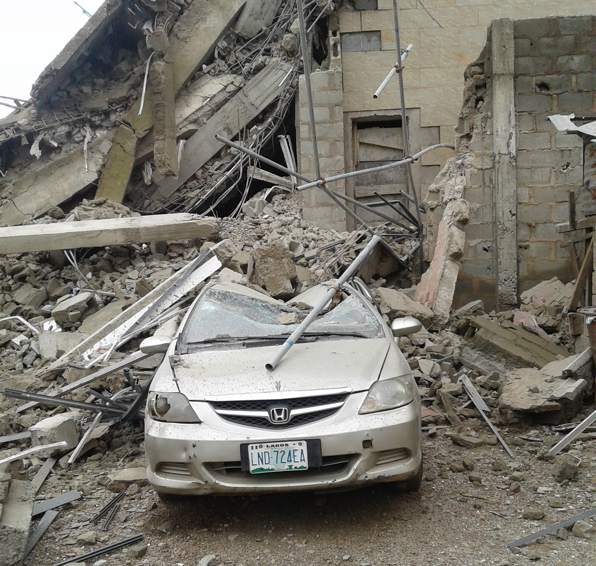Pic.8. A car at the scene of a four-storey building which collapsed on Zulu Gambari Road in Ilorin on Friday (18/8/17). 04372/18/8/2017/Olayinka Owolewa/BJO/NAN
