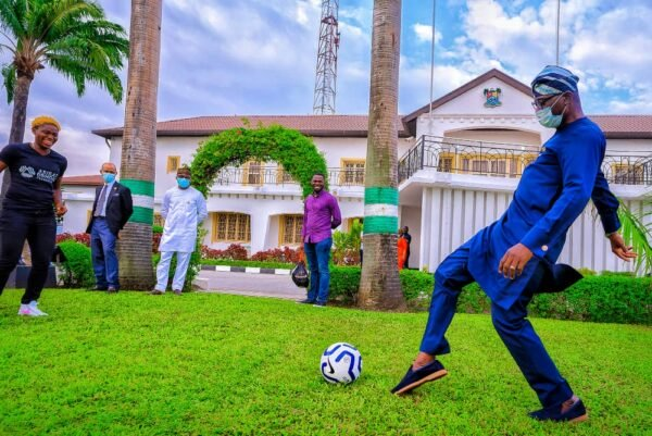 image (6) - THEWILL NEWS MEDIA Sanwo-Olu Displays Football Skills As Barcelona Star Oshoala Visits
