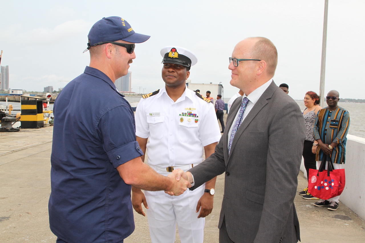 The U.S. Consul General Will Stevens (right) and Liaison Officer Western Navy Command Lieutenant Commander S. Ateru (middle) welcoming Mohawk’s Commanding Officer Andrew Pate (left) at the arrival of the United States Coast Guard Cutter Mohawk in Lagos.