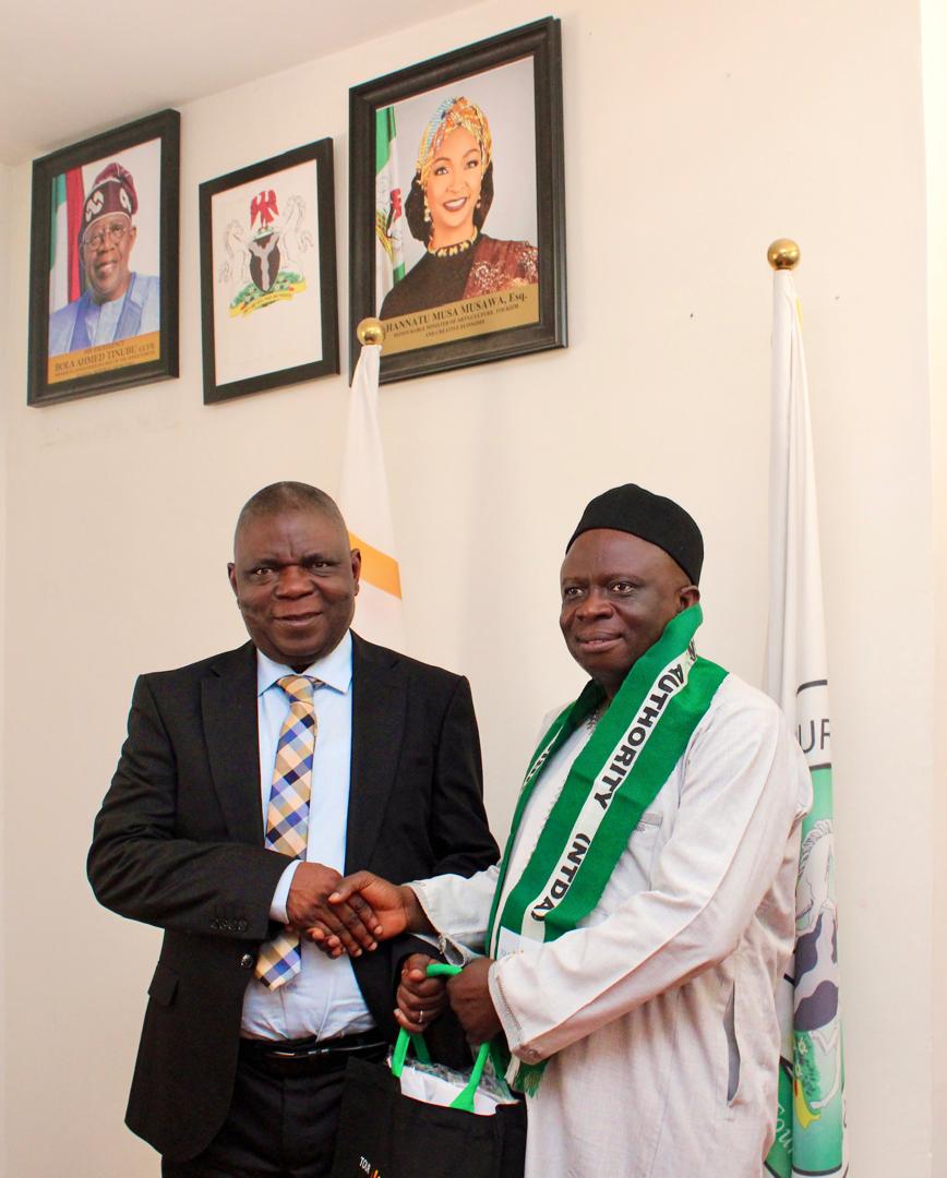 Director overseeing Office of the Director General, Nigerian Tourism Development Authority (NTDA), Mr Ovie Richard Esewhaye and the President, Federation of Tourism Associations of Nigeria (FTAN) after the latter was decorated as a Tourism Ambassador during the courtesy visit at the NTDA headquarters, Abuja