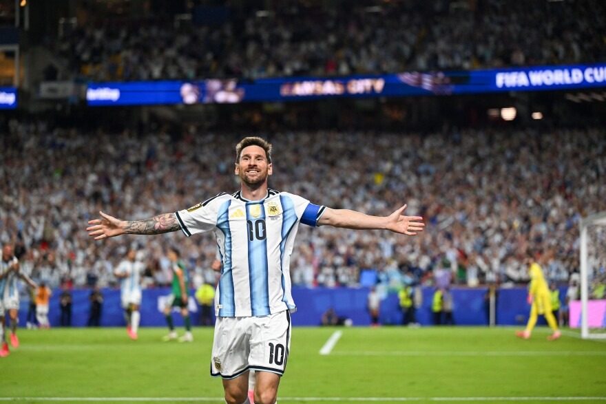 Argentina's Lionel Messi celebrating after scoring his second goal during the FIFA World Cup 2026 Group J match against Algeria at Kansas City Stadium, Kansas City, Missouri, June 16. - THEWILL NEWS MEDIA Argentinian soccer player wearing a blue-and-white striped jersey with number 10, arms outstretched on the pitch amid a crowded stadium crowd.