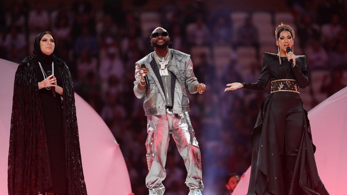Aisha, Davido and Rahma Riad performing at the 2022 FIFA World Cup in Qatar. Credit: Davido via Instagram - THEWILL NEWS MEDIA
