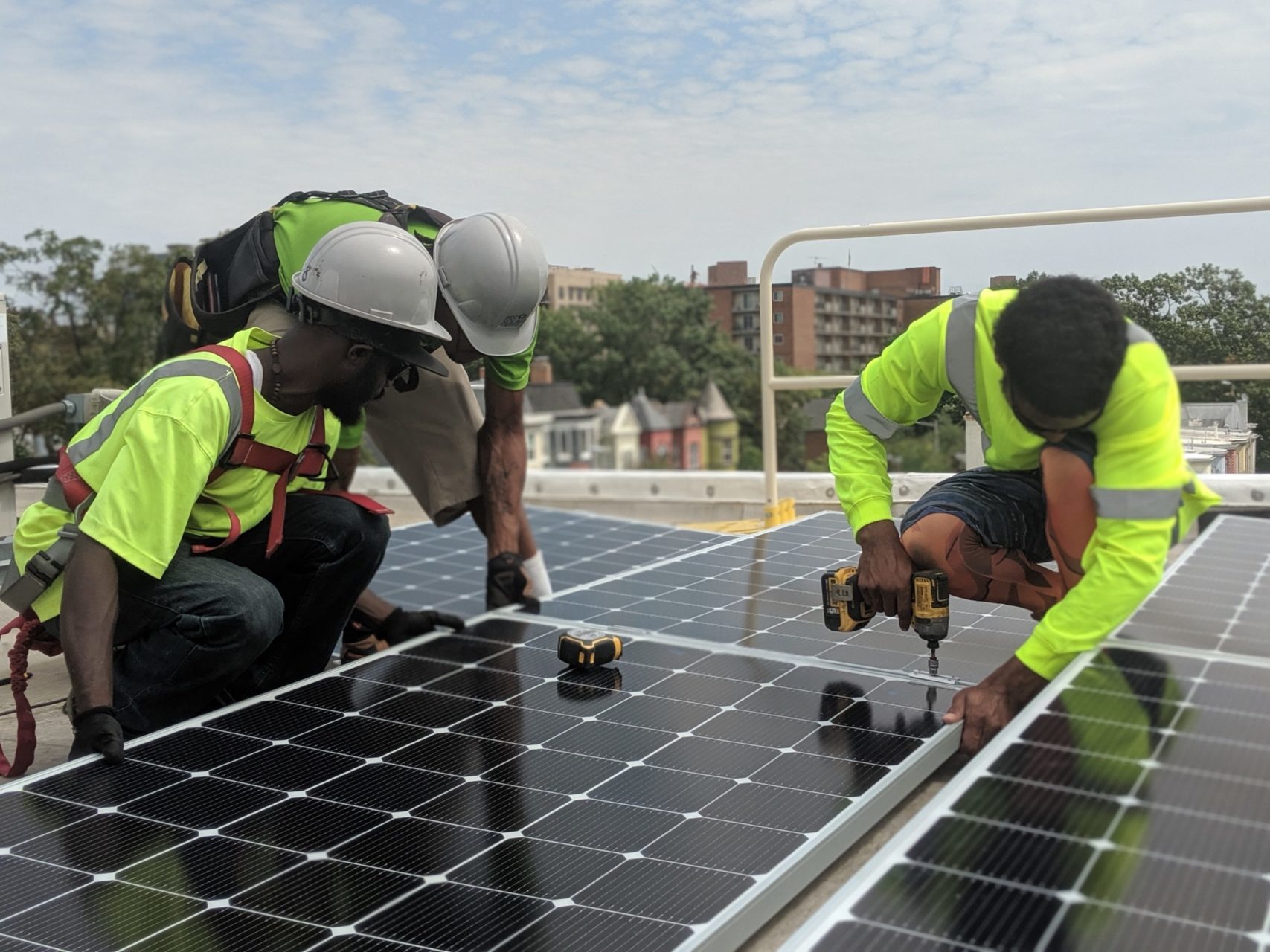 Renewable energy engineers configure a solar inverter system. Source: Community Solar - THEWILL NEWS MEDIA