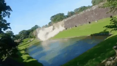 A section of the historic stone walls surrounding Kumamoto Castle collapses into the moat following the powerful earthquake that struck Japan's Kyushu region, highlighting the extent of the seismic damage. Photo credit: Courtesy/Video grab. - THEWILL NEWS MEDIA
