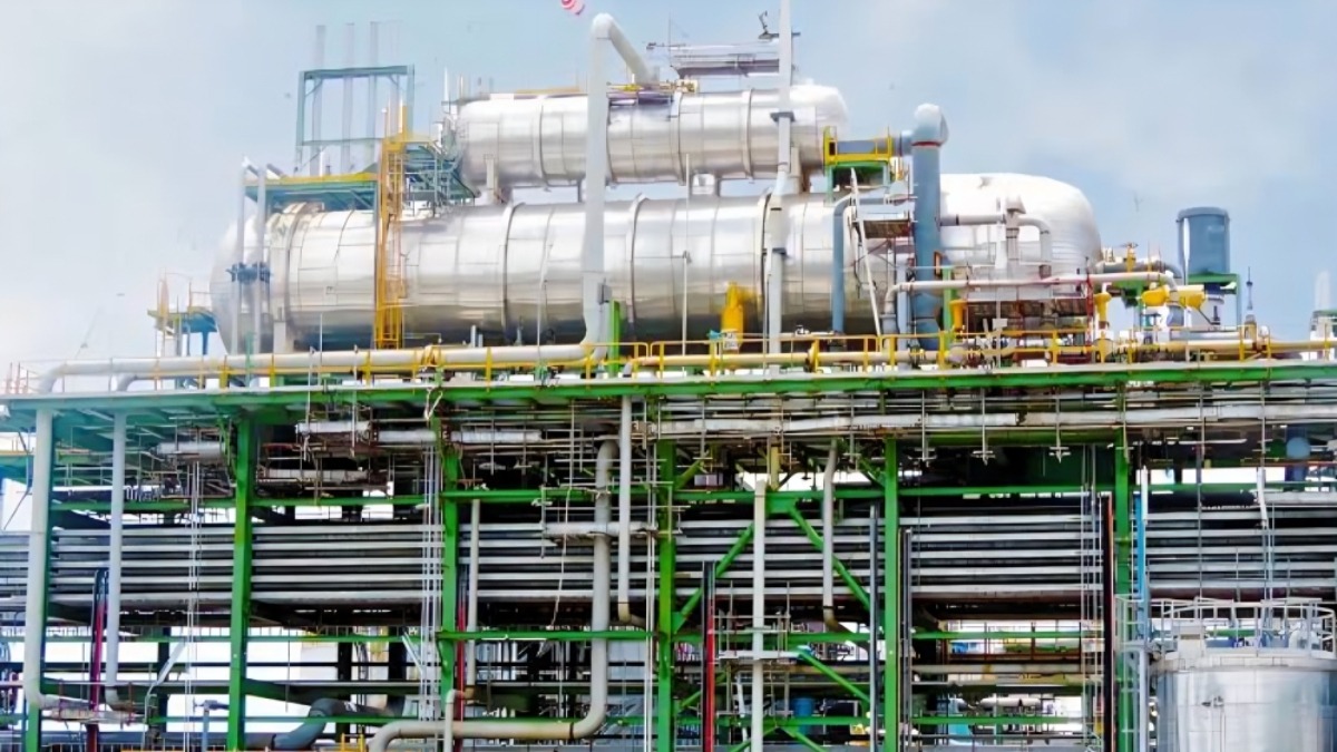 Dangotes processing facilities - THEWILL NEWS MEDIA Industrial chemical plant with a dense network of pipes and steel framework across multiple levels.