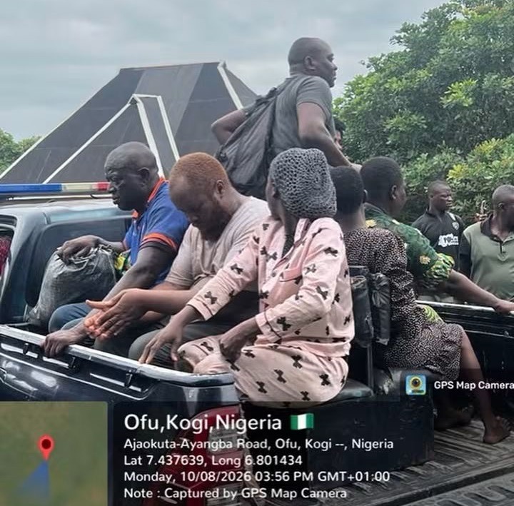 Kogi Kidnap Victims 2 - THEWILL NEWS MEDIA Group of people riding in the open bed of a pickup truck near a solar-panel structure, Ofu, Kogi, Nigeria (location overlay visible).