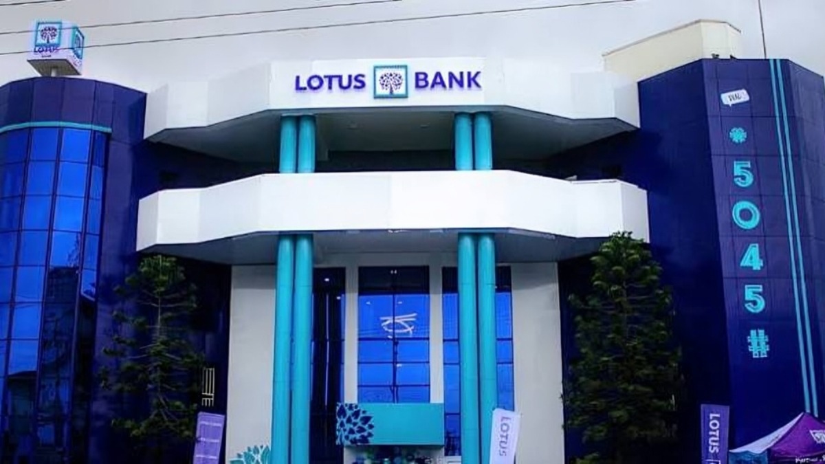 Lotus Bank - THEWILL NEWS MEDIA Front view of a Lotus Bank building with blue and teal architectural columns and signage reading'LOTUS BANK'