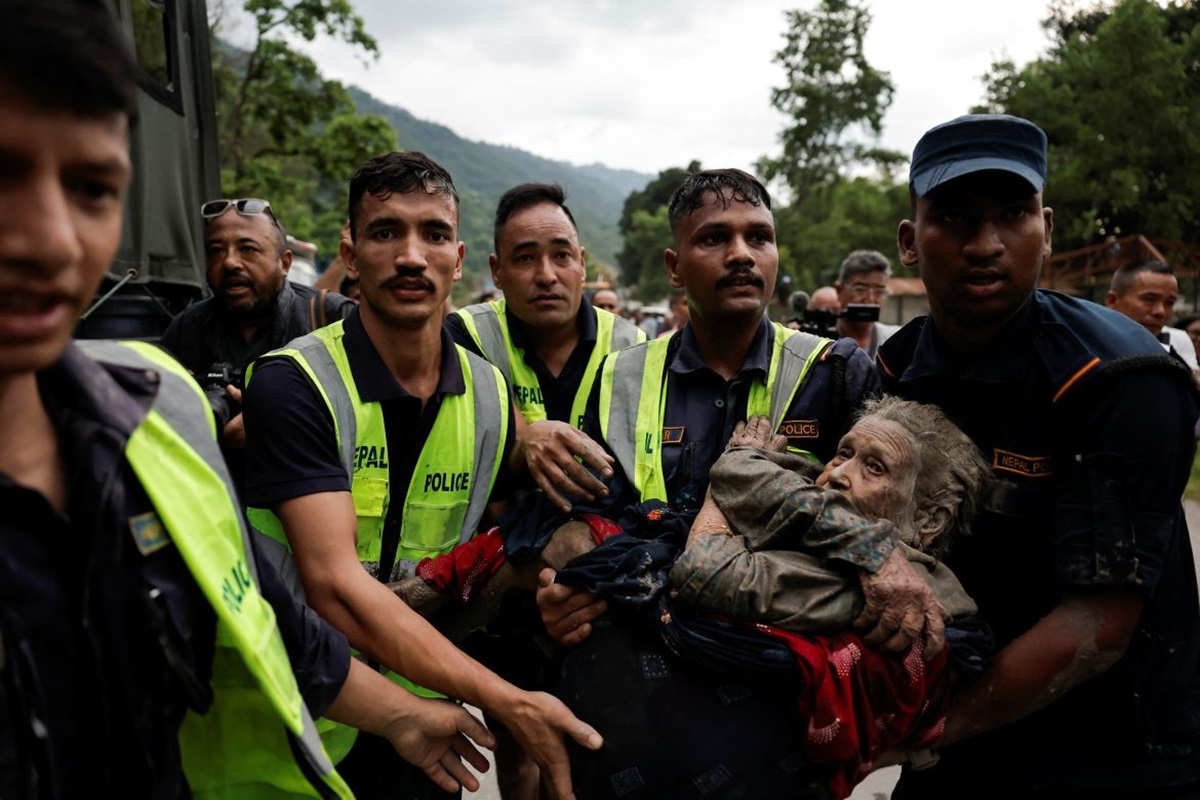 Rescuers carry a survivor following the flash flood in Trishuli - THEWILL NEWS MEDIA Rescuers carry a survivor following the flash flood in Trishuli