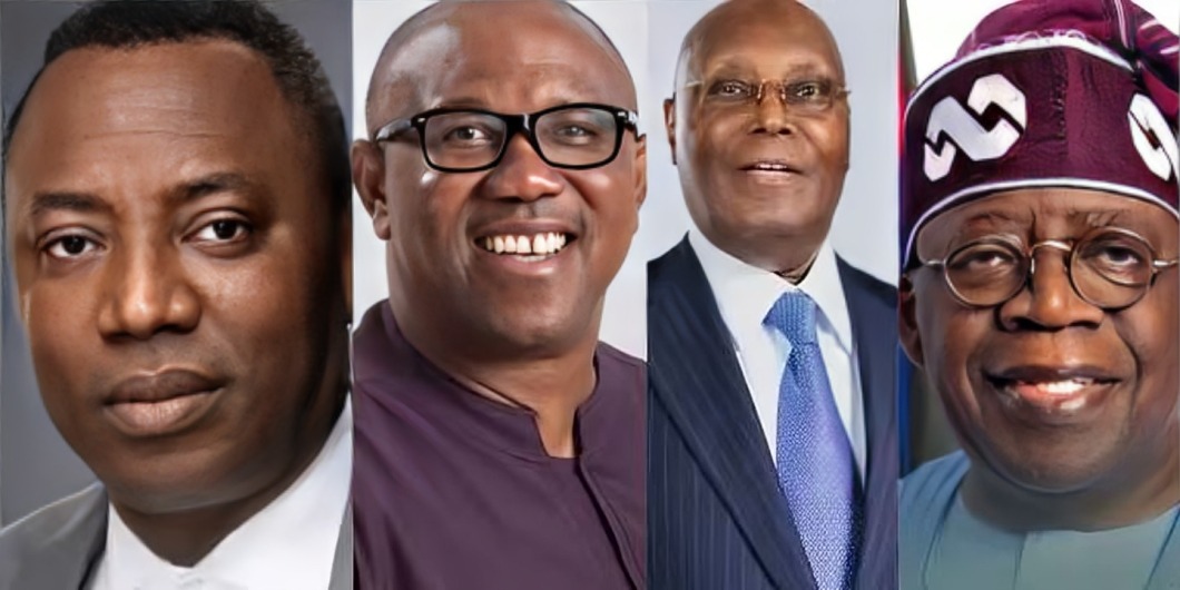 Sowore,Atiku,Obi,Tinubu - THEWILL NEWS MEDIA Composite image of four smiling men in professional attire lined up side by side: from left to right, a man in a light suit, a man with glasses, a man in a dark suit with a blue tie, and a man wearing a purple headscarf and glasses.