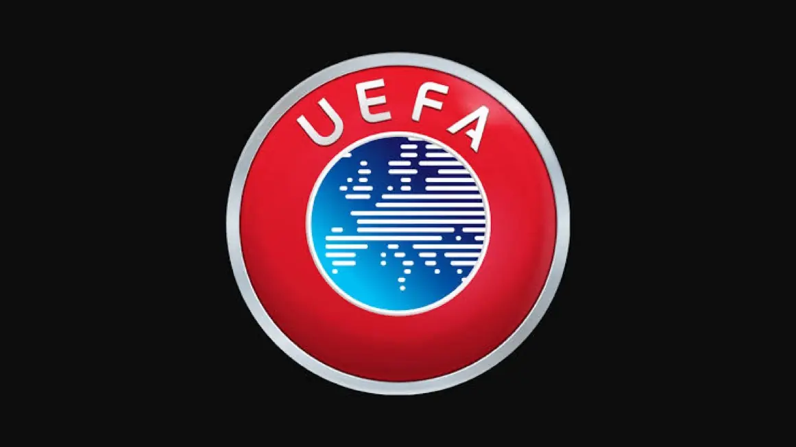 UEFA - THEWILL NEWS MEDIA UEFA logo: red circular badge with silver rim and a blue globe in the center.