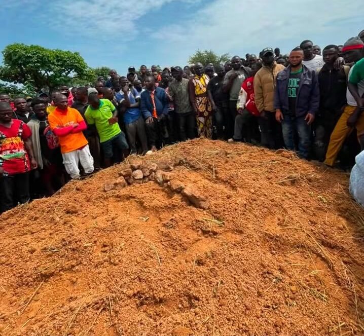 victims of gunmen attacks in Mangu Community - THEWILL NEWS MEDIA Residents gather around a mass grave during the burial of victims of gunmen attacks in Mangu Community, Plateau State.