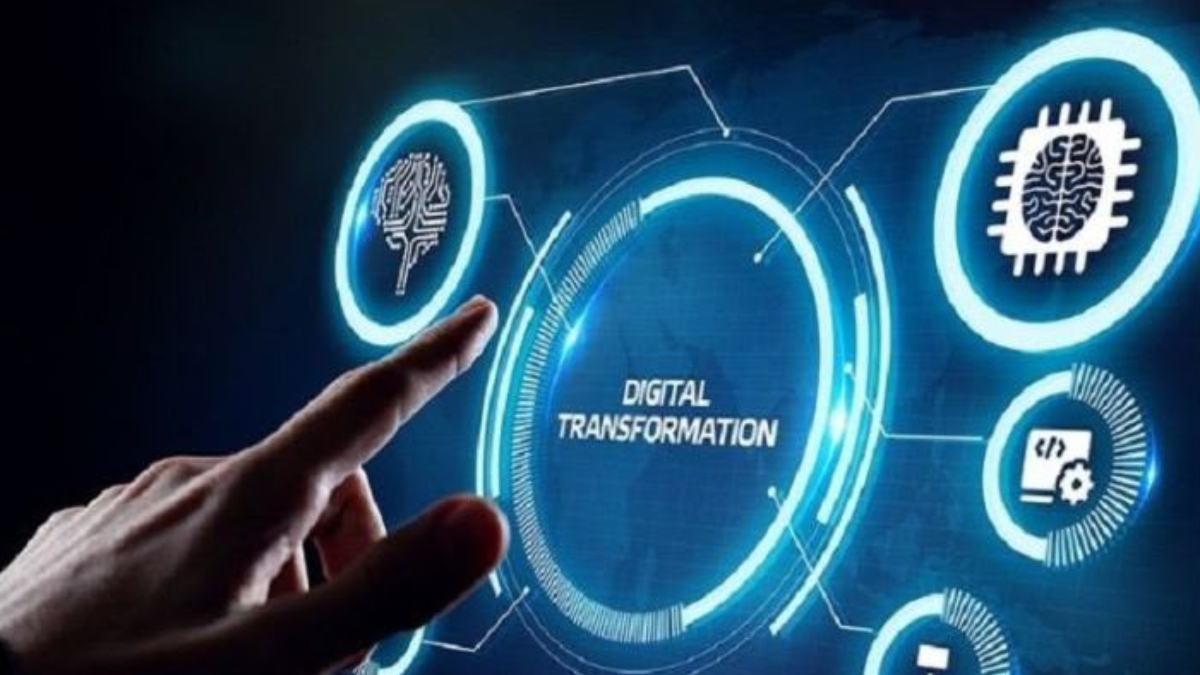 Digital transformation - THEWILL NEWS MEDIA Hand pointing toward a glowing digital transformation interface with circular tech icons and circuits to convey modernizationTech concepts.