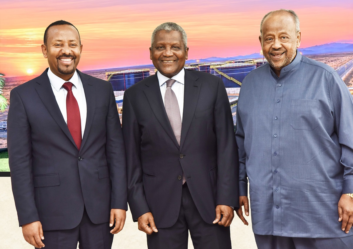 Ethiopia Djibouti leaders back Dangote - THEWILL NEWS MEDIA Three men in business attire stand together outdoors at a solar farm during sunset, smiling for the photo.