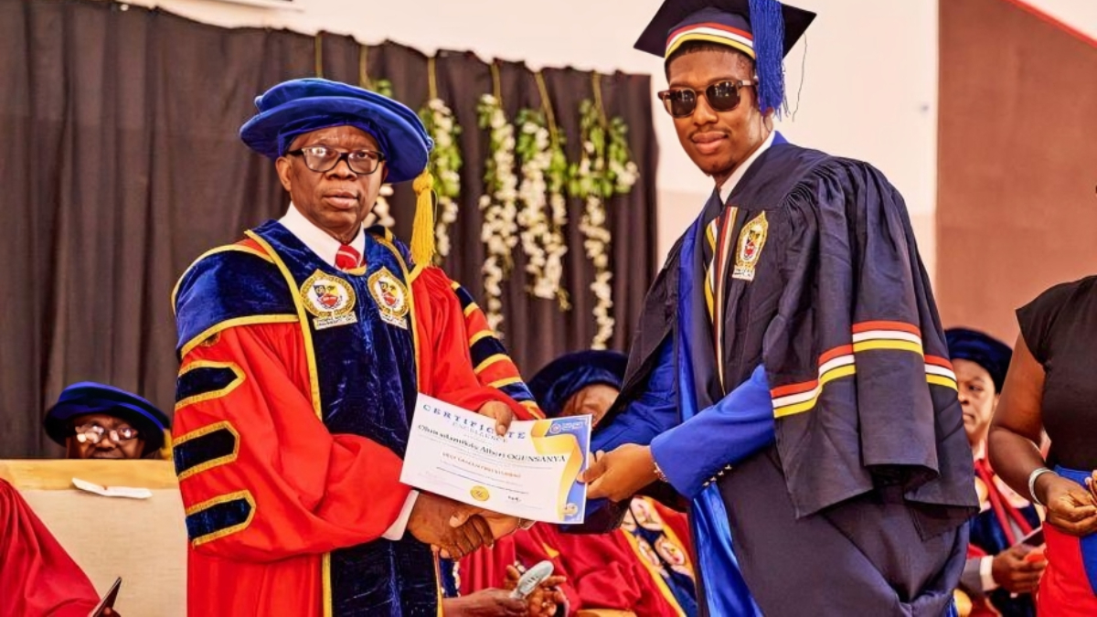 Graduate receiving their academic certificate - THEWILL NEWS MEDIA Graduate receiving their academic certificate