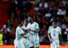 Guinea-Bissau Shock Nigeria With 3-0 Defeat as Super Eagles’ AFCON 2027 Qualification Hopes Take a Hit Nigerian national football team players celebrate a goal on the pitch as teammates embrace, with a crowd behind them.