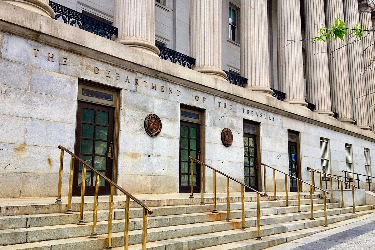 United States Department of the Treasury building - THEWILL NEWS MEDIA Front of a neoclassical government building with tall columns and the words'The Department of the Treasury' on the facade.