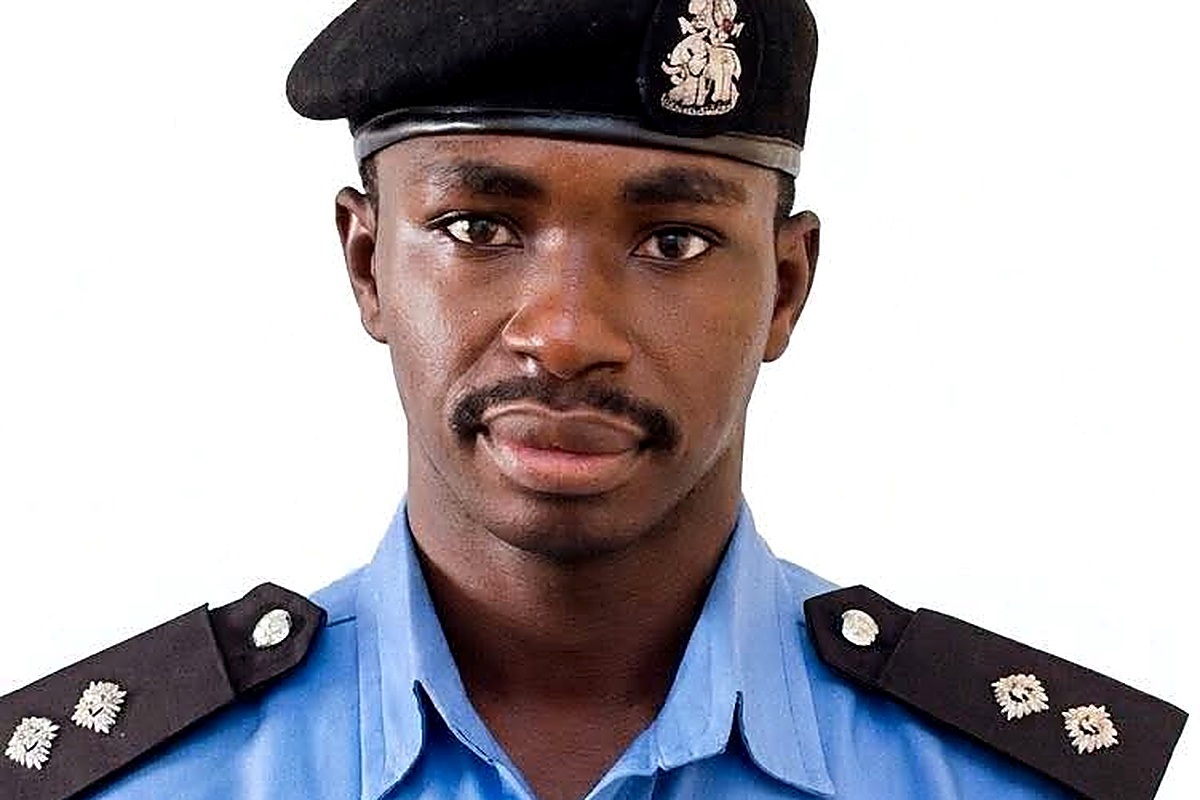 ASP Yusuf Adamu Aliyu - THEWILL NEWS MEDIA Portrait of a man in a blue police-style uniform with a black beret bearing an insignia, facing the camera.