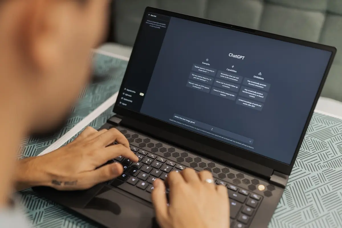 A person uses ChatGPT through a laptop browser - THEWILL NEWS MEDIA Website