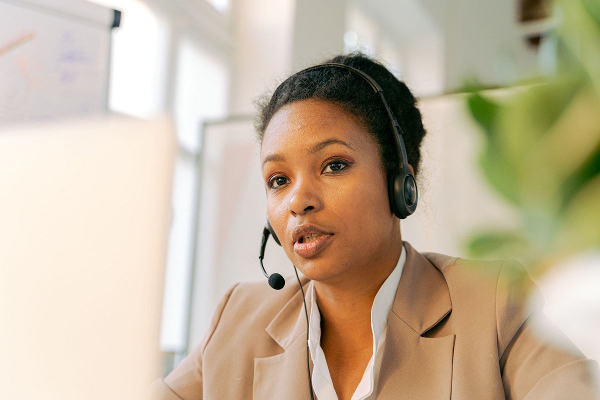 A customer-support worker speaks through a headset - THEWILL NEWS MEDIA Loan