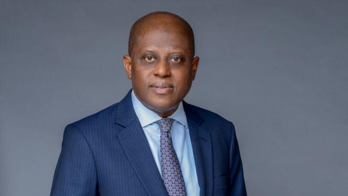 Olayemi Cardoso - THEWILL NEWS MEDIA Professional head-and-shoulders portrait of a bald Black man in a navy pinstripe suit and light blue shirt with a calm expression.