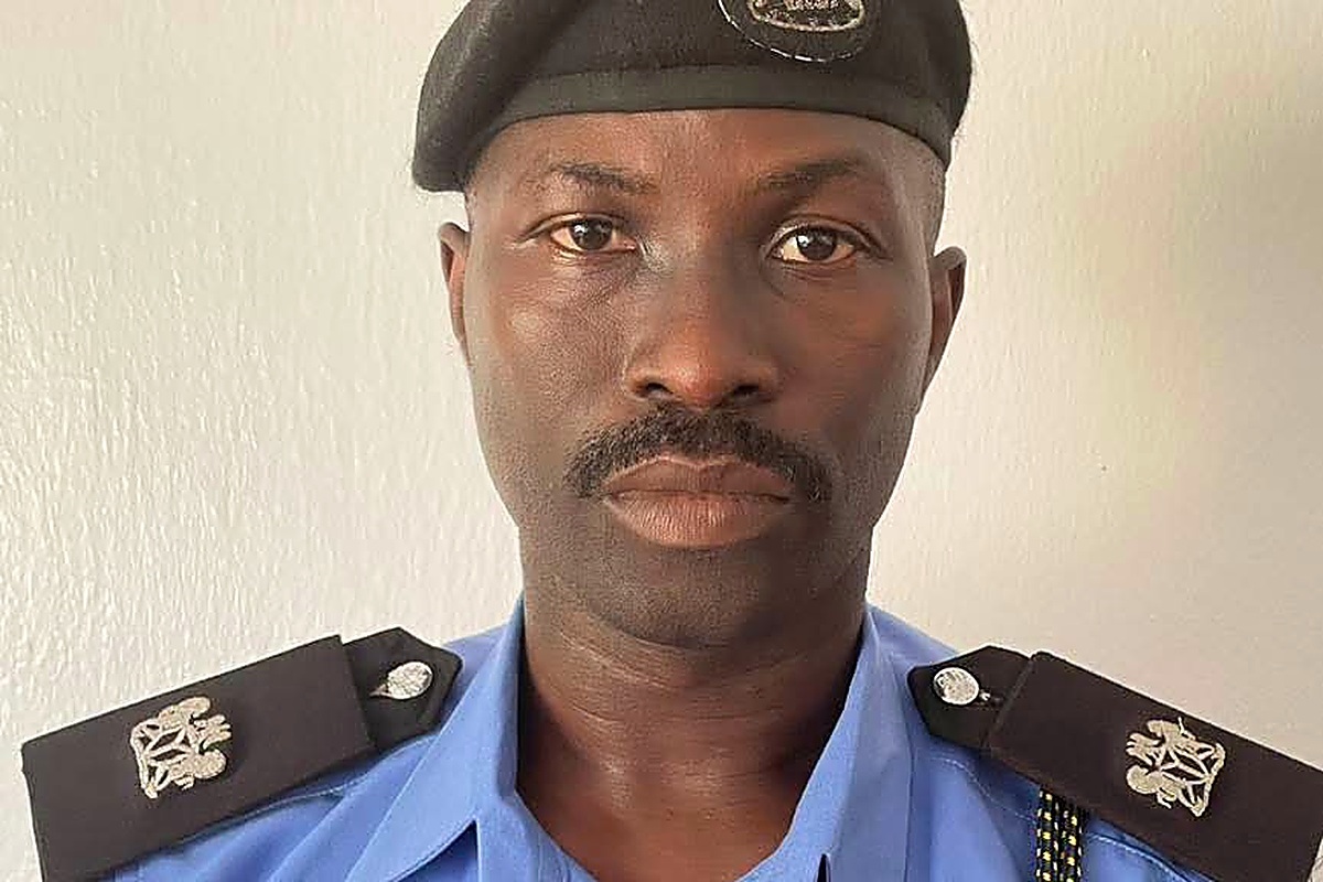 SP Ojedele Olanrewaju Tunji - THEWILL NEWS MEDIA A man in a police uniform with a blue shirt, black beret, and shoulder epaulettes standing against a light wall; neutral expression.