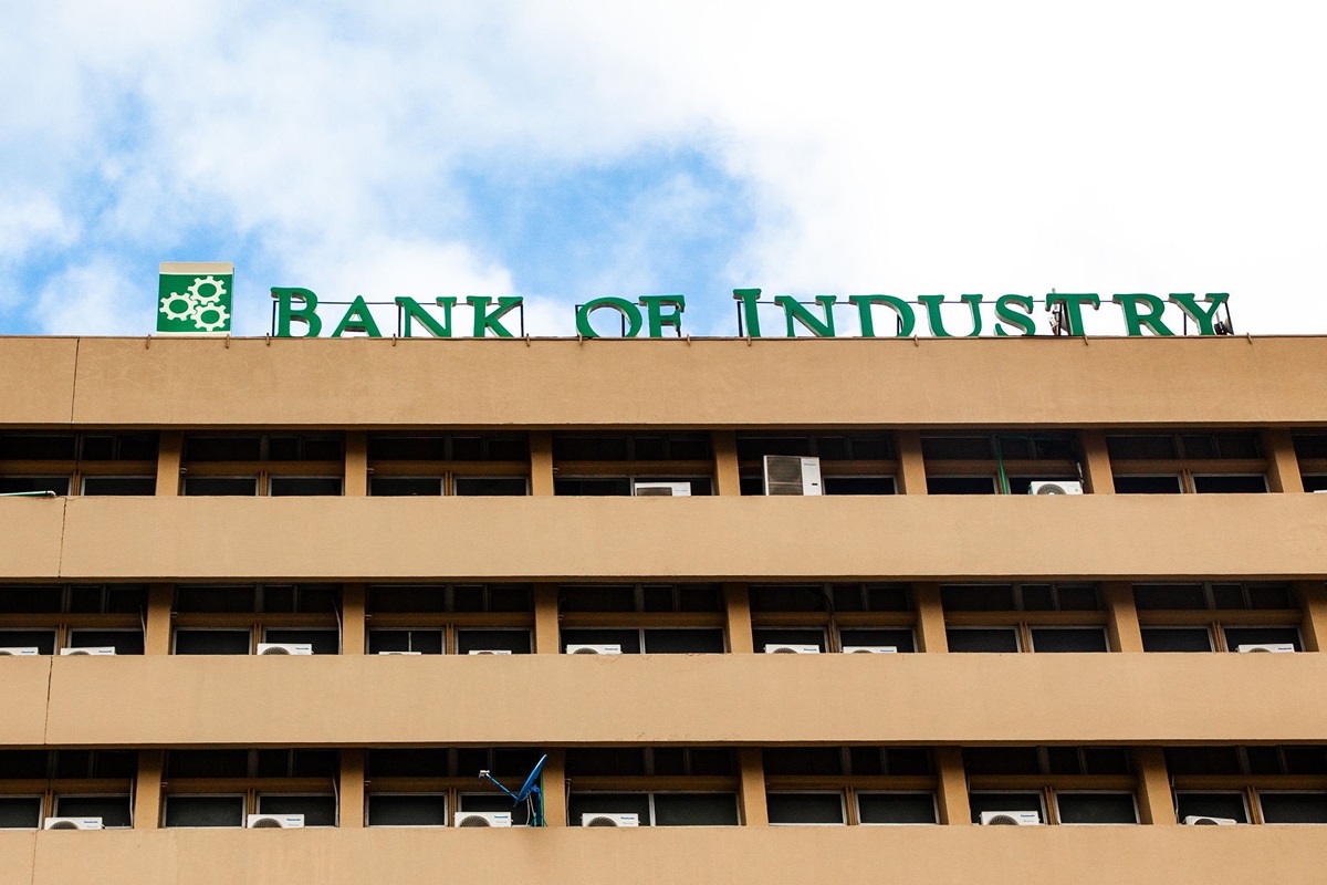 The Bank of Industry - THEWILL NEWS MEDIA Bank of Industry sign atop a tan office building against a blue sky.