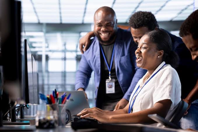 Workers on a computer - THEWILL NEWS MEDIA Citi
