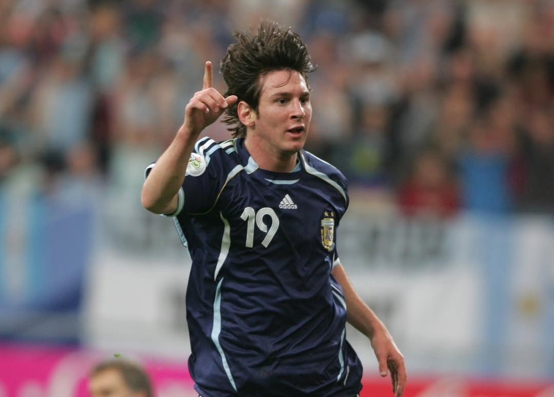 messi - THEWILL NEWS MEDIA Male soccer player in a navy jersey with number 19 celebrates by raising his index finger during a match.